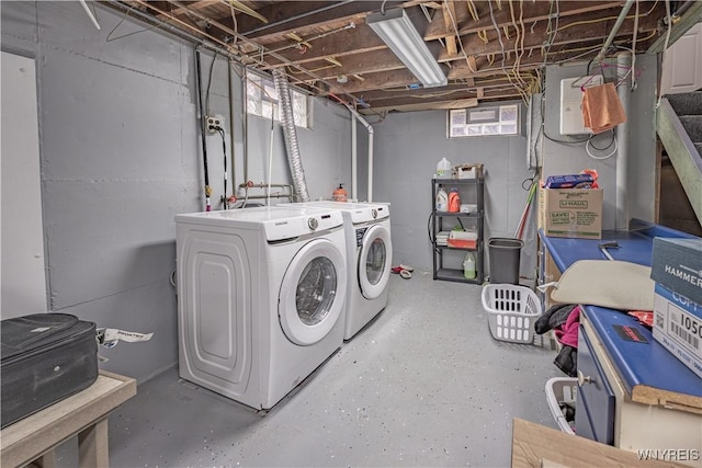 washroom featuring separate washer and dryer and plenty of natural light