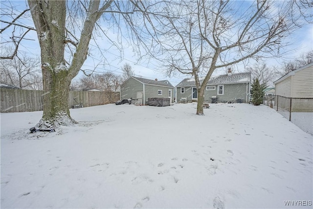 view of yard layered in snow