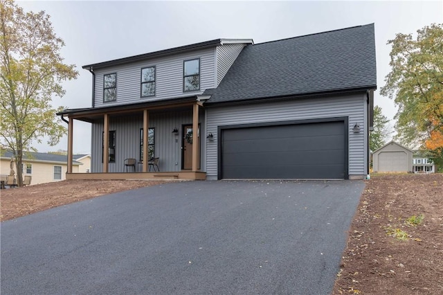 view of front of house with a garage and a porch