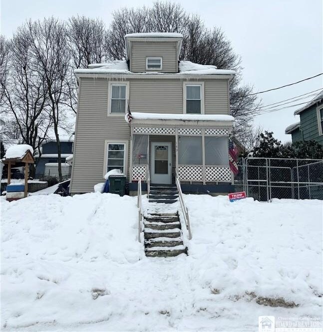 view of snow covered property