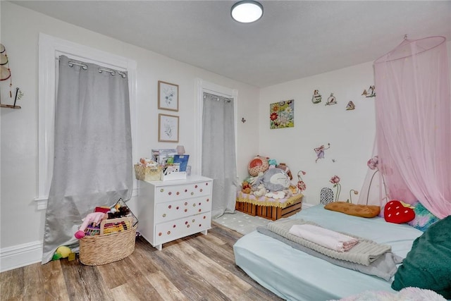 bedroom with light wood-type flooring