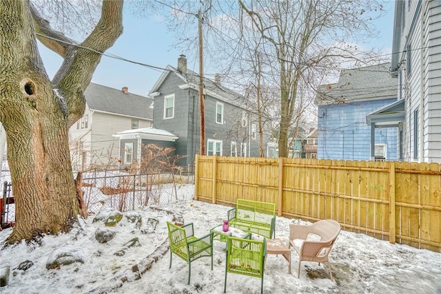 view of yard layered in snow