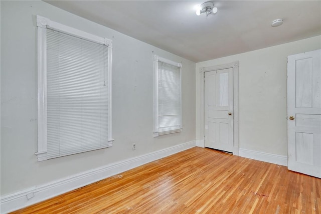 unfurnished room featuring light wood-type flooring