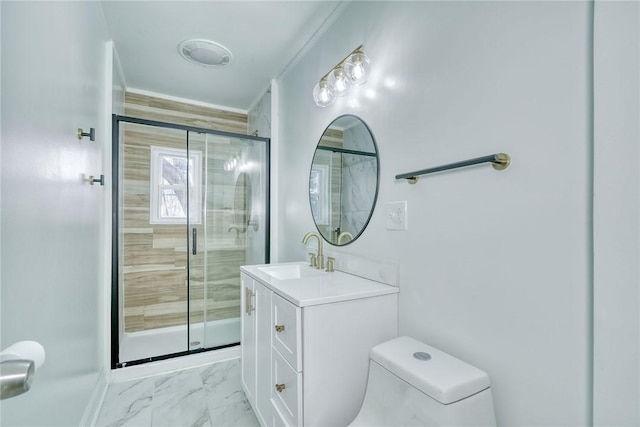 bathroom with vanity, toilet, and an enclosed shower