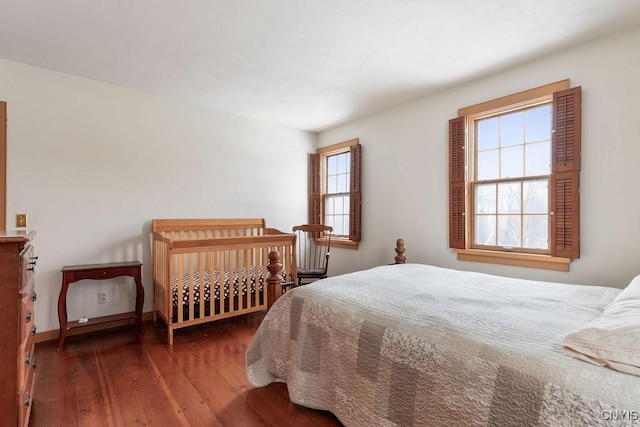 bedroom with hardwood / wood-style flooring