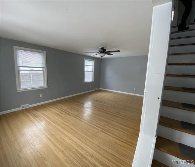 spare room featuring ceiling fan and light wood-type flooring