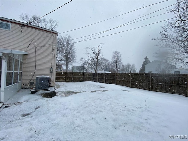 yard layered in snow with cooling unit