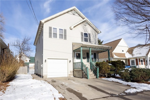 front facade with a garage and covered porch