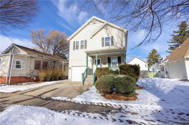 front facade with a garage and covered porch