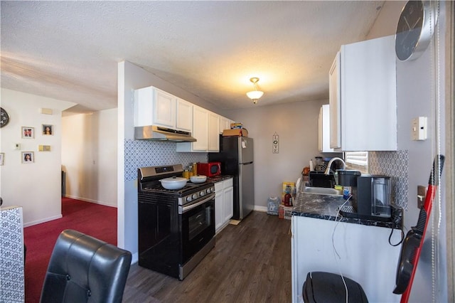 kitchen with sink, dark wood-type flooring, appliances with stainless steel finishes, white cabinetry, and backsplash