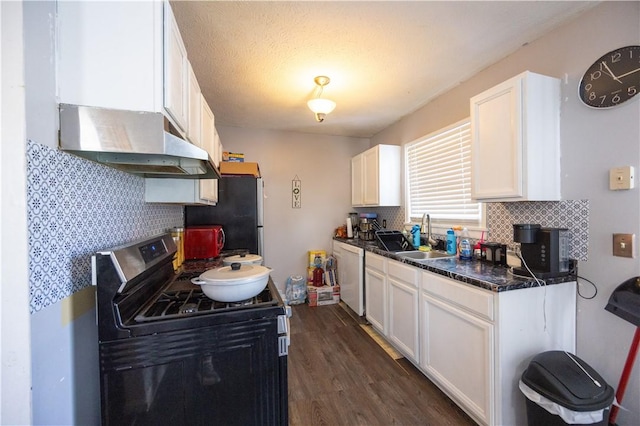 kitchen featuring sink, dark hardwood / wood-style floors, stainless steel appliances, decorative backsplash, and white cabinets