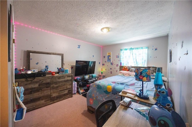 bedroom featuring carpet flooring and a textured ceiling