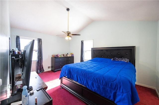 carpeted bedroom with vaulted ceiling and ceiling fan