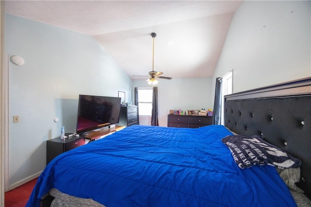 bedroom with lofted ceiling, carpet flooring, and ceiling fan