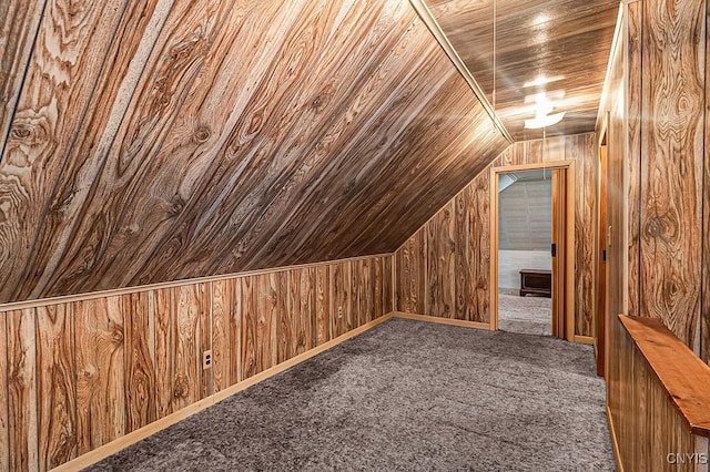 bonus room with lofted ceiling, wooden walls, carpet floors, and wooden ceiling