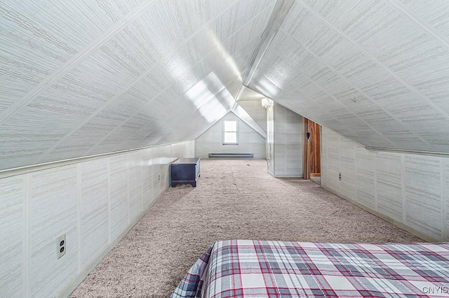 unfurnished bedroom with a baseboard radiator, lofted ceiling, and carpet