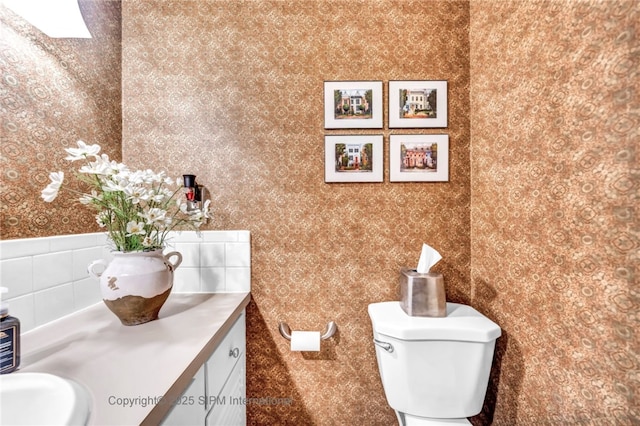 bathroom featuring sink and toilet