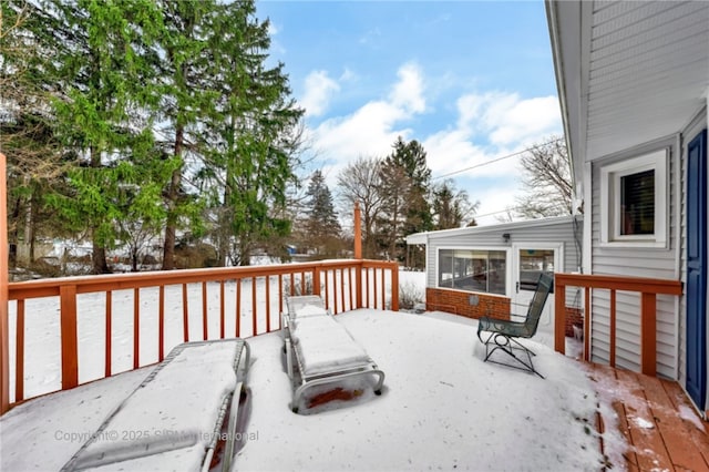 view of snow covered deck