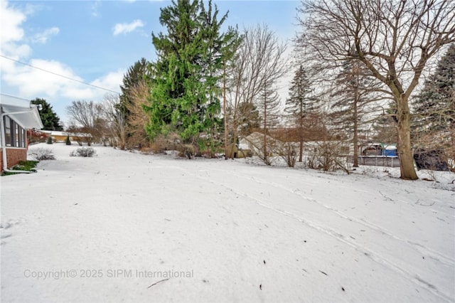 view of yard covered in snow