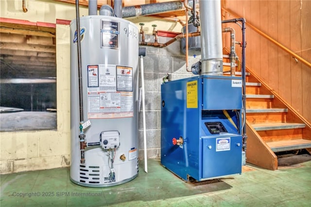 utility room featuring water heater