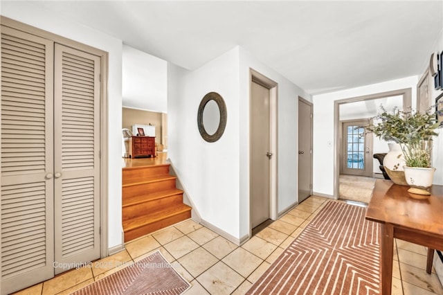 hallway with light tile patterned floors