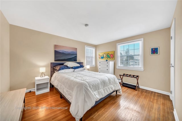 bedroom with hardwood / wood-style flooring