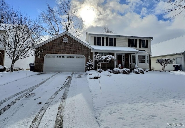 view of property featuring a garage and covered porch