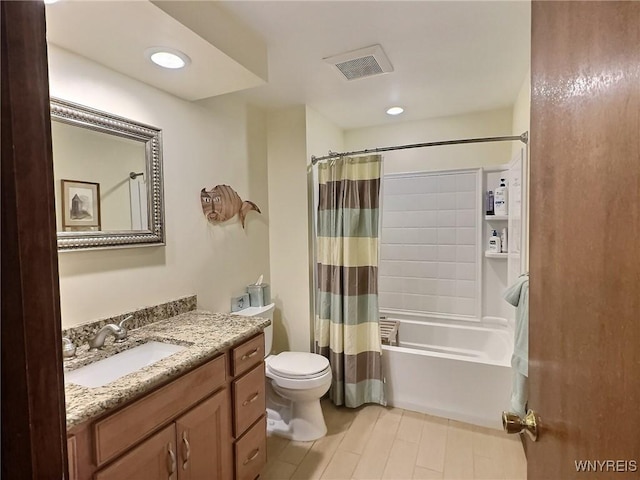 full bathroom with vanity, shower / bath combo, and toilet