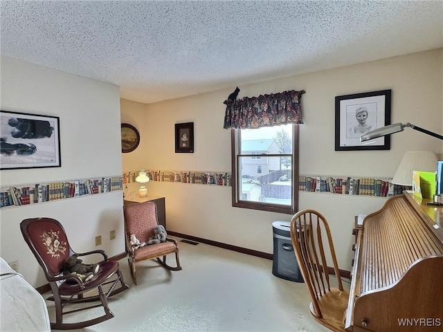 living area with a textured ceiling and carpet