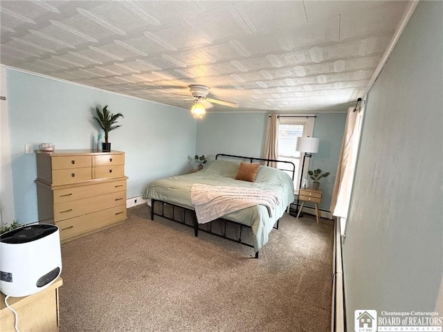 bedroom with a baseboard heating unit, carpet flooring, and ceiling fan