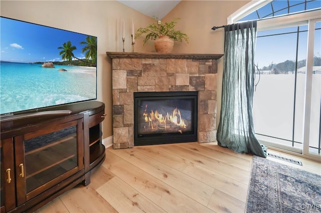 1771 Independence, Utica, NY 13502 - room details with a glass covered fireplace, visible vents, and wood finished floors