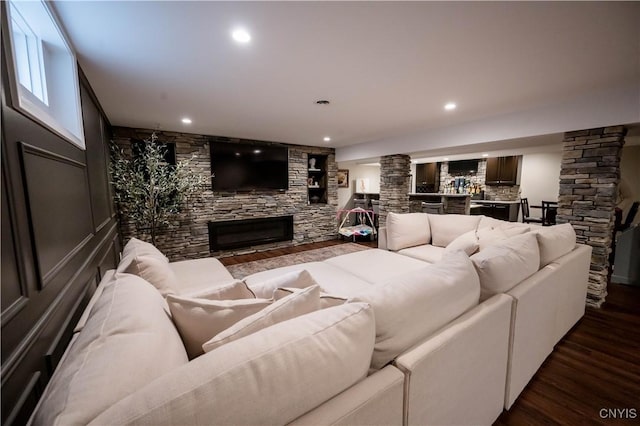 1771 Independence, Utica, NY 13502 - living room with decorative columns, a fireplace, dark wood-style flooring, and recessed lighting