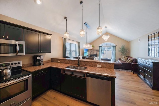 1771 Independence, Utica, NY 13502 - kitchen with a wealth of natural light, a peninsula, appliances with stainless steel finishes, a sink, and open floor plan