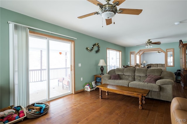 living room with hardwood / wood-style flooring and ceiling fan