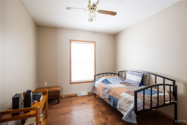 bedroom featuring dark hardwood / wood-style floors and ceiling fan