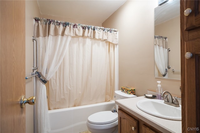 full bathroom with vanity, shower / bath combination with curtain, and toilet