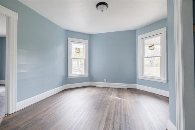 empty room with hardwood / wood-style floors