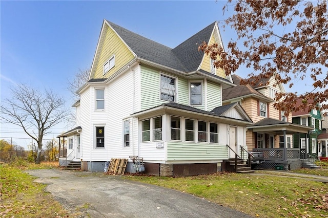 exterior space with a lawn and a porch