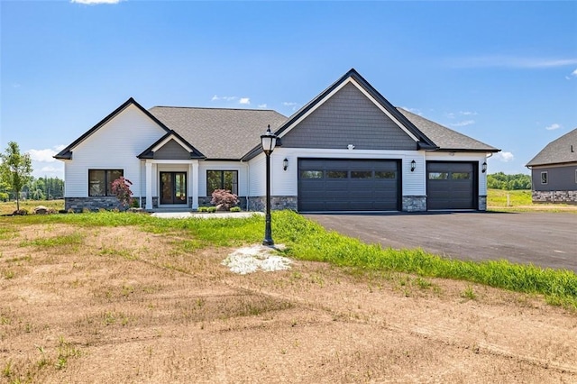 view of front of house featuring a garage and a front yard