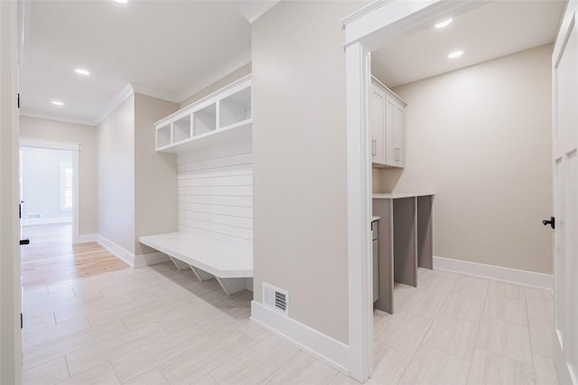 mudroom featuring ornamental molding