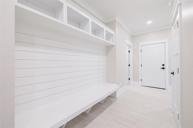 mudroom featuring crown molding