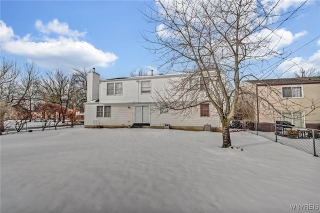 view of snow covered house