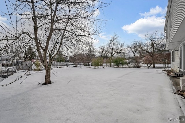 view of yard covered in snow