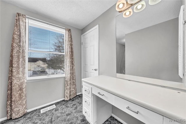 bathroom featuring vanity and a textured ceiling