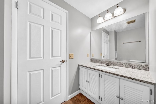 bathroom with tile patterned floors and vanity