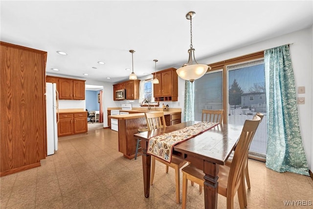 dining space with sink