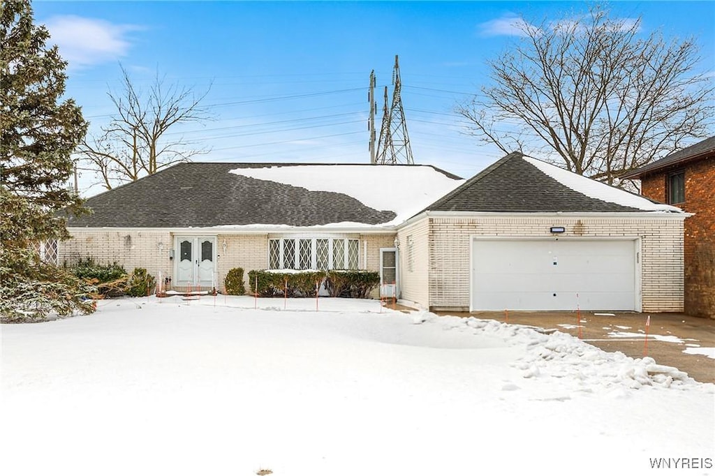 ranch-style home with a garage