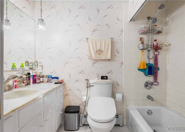 full bathroom with vanity, tiled shower / bath, toilet, and baseboard heating