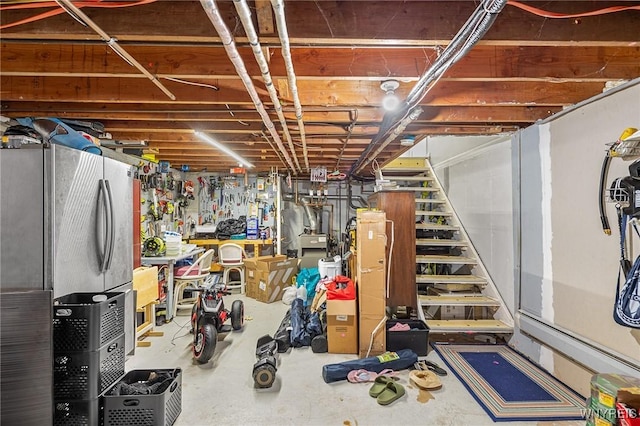 basement with stainless steel fridge