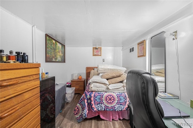 bedroom featuring dark hardwood / wood-style floors